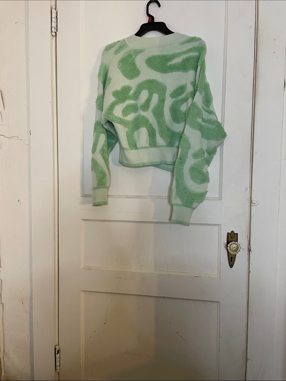 Ladies short cardigan sweater.”